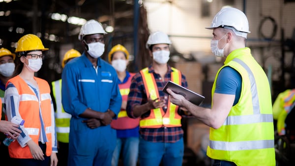 field employees meeting with masks